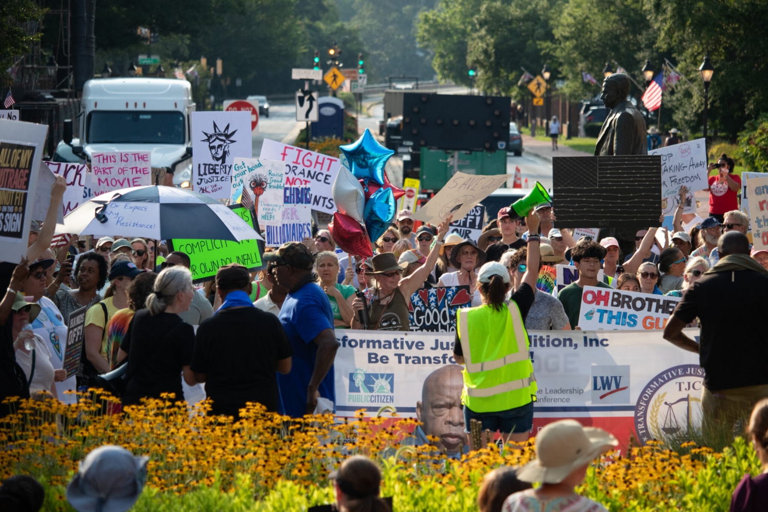 Hundreds bring 'good trouble' rally to State House steps