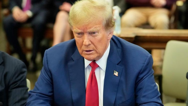 World shares sink after Trump escalates feud with the Federal Reserve