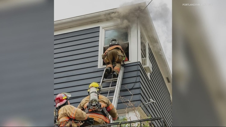 Firefighters save unconscious man's life by pulling him through bedroom window in Portland apartment fire