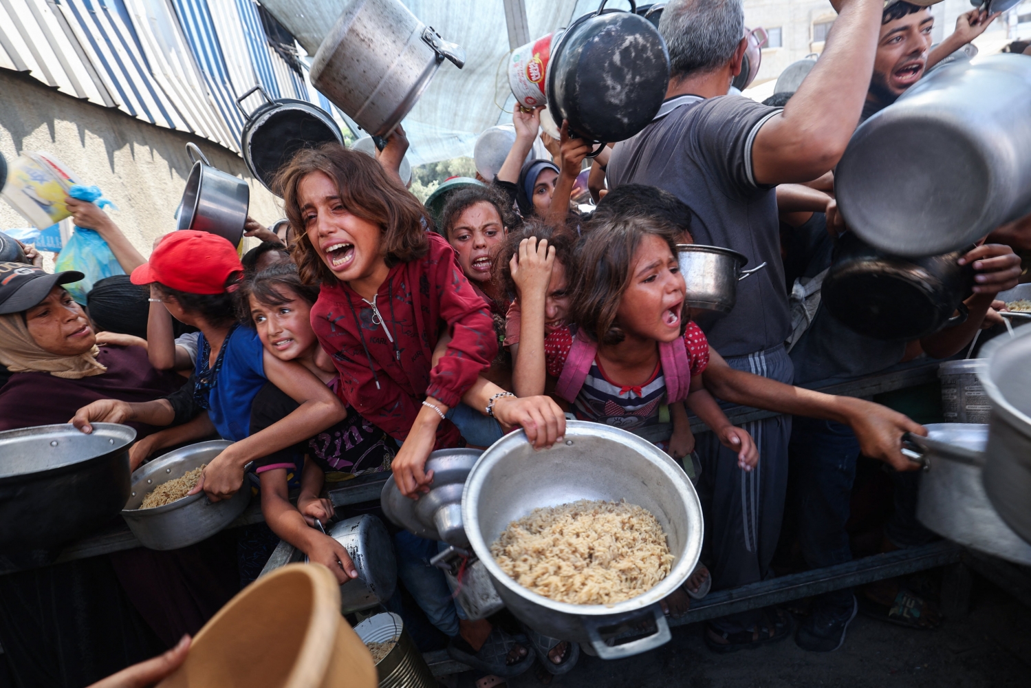 Denying famine, Israel threatens more curbs on Gaza aid