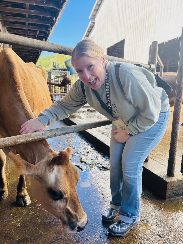 During Leadership Coos' Gratitude day Alyssa took a photo with a dairy cow at River Bend Jerseys, Mahaffy’s Organic Dairy