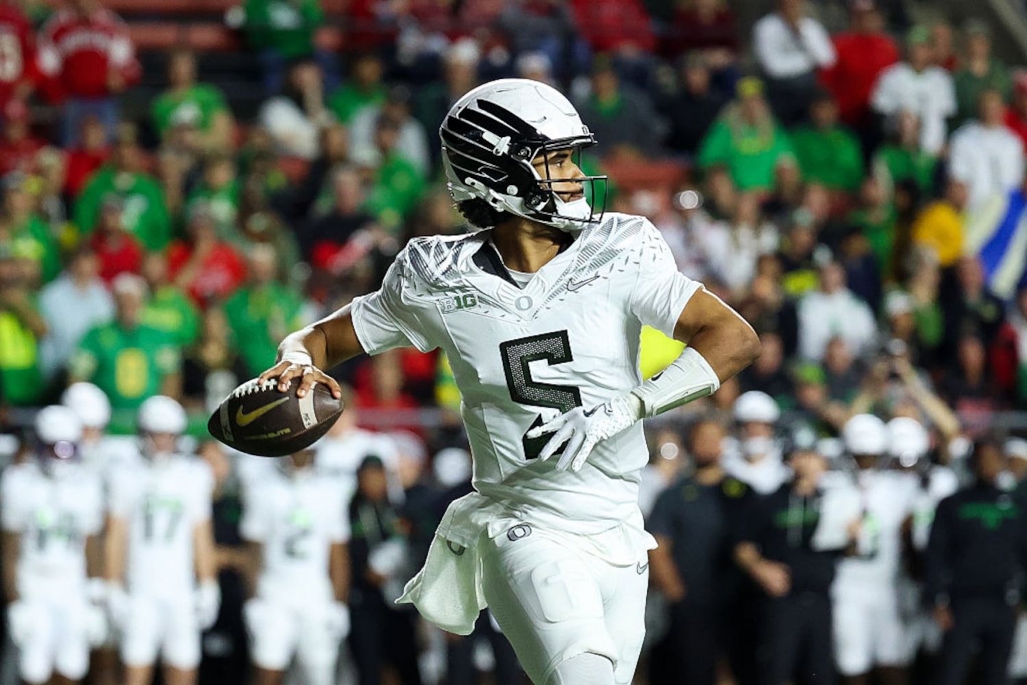 Dante Moore leads Oregon to historic offensive output in 56-10 win at Rutgers
